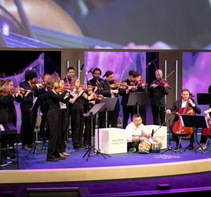 Hal Unik Seorang konduktor mengundang para pengungsi yang belum pernah memainkan alat musik untuk bergabung dengan orkestranya. Itu mengubah hidupnya